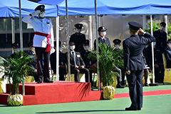 The Deputy Commissioner (Administration) of Civil Aid Service, Mr Wilfred Lam (position), takes the salute from the parade.