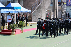 The members demonstrate Chinese-style flag raising ceremony.