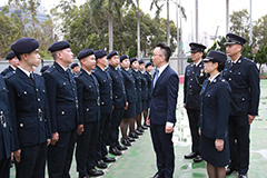 The Permanent Secretary for Security, Mr Li Pak-chuen inspects the parade.