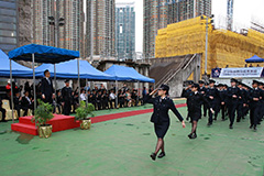 The parade marches past the review stand.