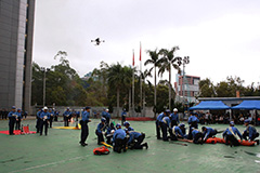 The members conduct an aerial detection with drones during the rescue demonstration.