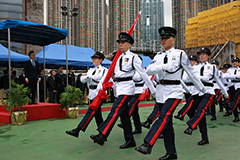 The members take part in the Chinese-style flag raising ceremony.